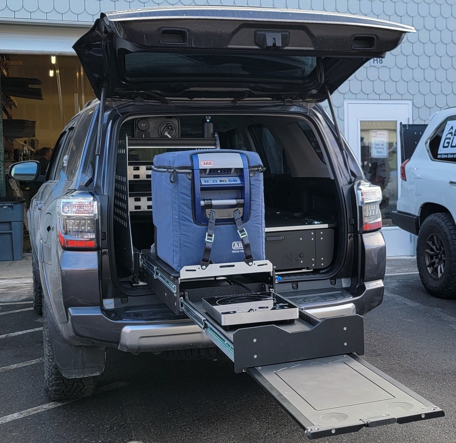 Toyota 4Runner Kitchen, Fridge Slide , work surface, storage drawers and sleeping platform . Organization for overland adventure.