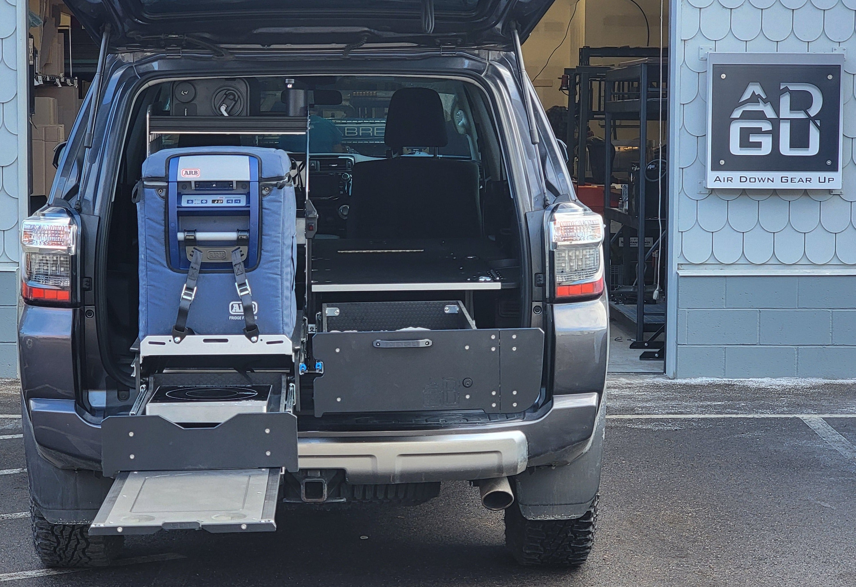 Toyota 4Runner Kitchen, Fridge Slide , work surface, storage drawers and sleeping platform . Organization for overland adventure.