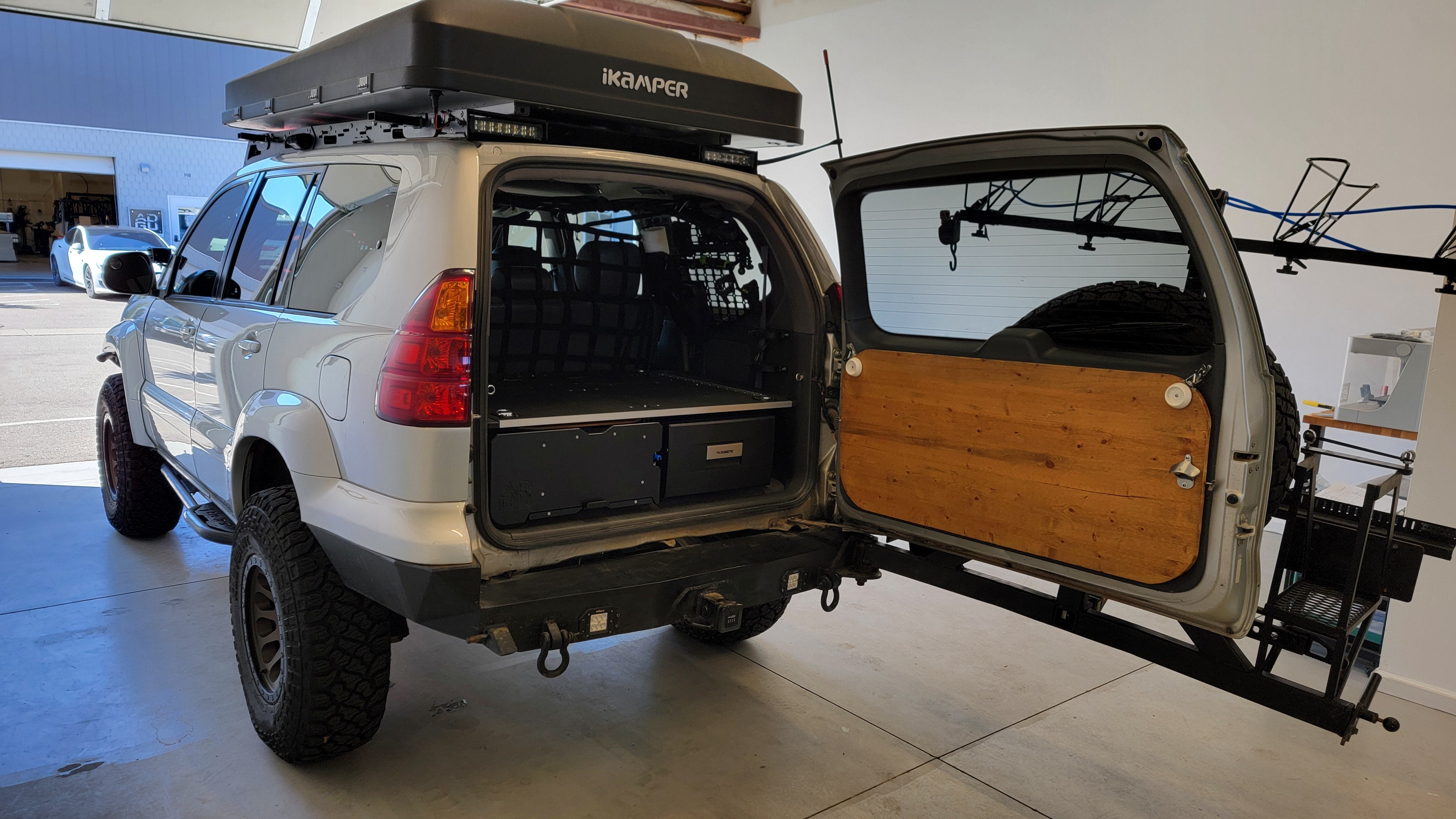 GX470 drawer storage system with fridge and sleeping platform for vehicle organization